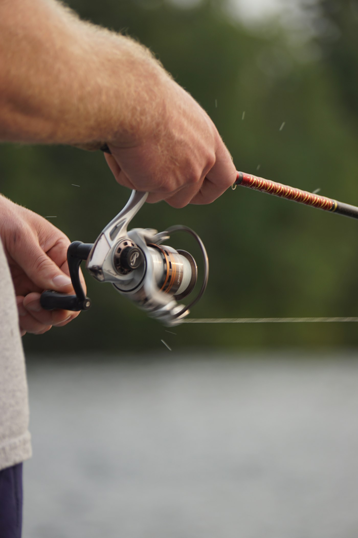 An angler holding a rod and reel